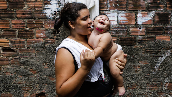 Cleane Stefani with Maria Eduarda, whose mother caught the Zika virus during pregnancy