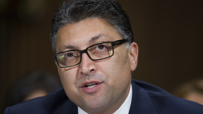 FILE - In this Wednesday, May 10, 2017, file photo, Assistant Attorney General, Antitrust Division nominee Makan Delrahim testifies before the Senate Judiciary Committee's hearing on his nomination, on Capitol Hill in Washington. Delrahim is now the Justice Department's antitrust chief. The Justice Department intends to sue AT&T to stop its $85 billion purchase of Time Warner, according to a person familiar with the matter who was not authorized to discuss the matter ahead of the suit's official filing. (AP Photo/Cliff Owen, File)