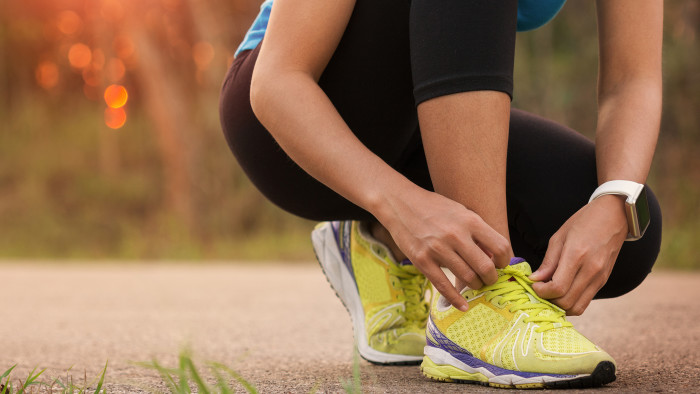 woman tying sport shoes ready for run