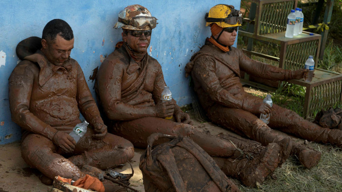 FILE PHOTO: Members of a rescue team react upon returning from the mission, after a tailings dam owned by Brazilian mining company Vale SA collapsed, in Brumadinho, Brazil January 28, 2019. REUTERS/Washington Alves/File Photo