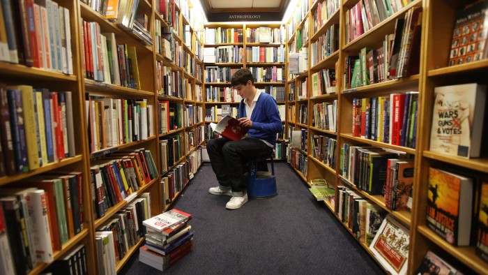 An Oxford student in a Blackwells bookstore