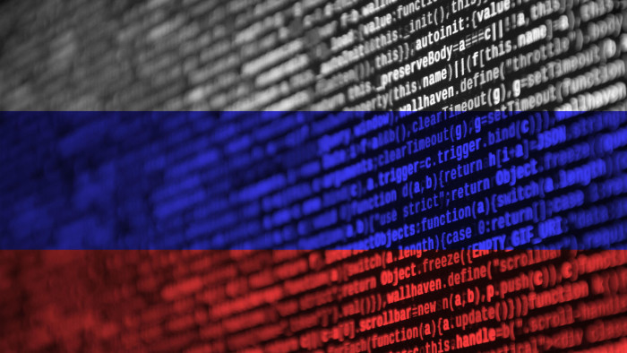 T505R8 Russia flag is depicted on the screen with the program code. The concept of modern technology and site development.