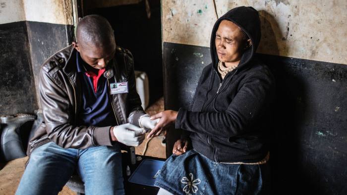 A Johannesburg resident is tested for HIV by an MSF health worker