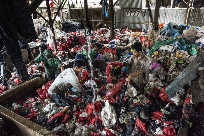 Washing plastic bags at Bantar Gebang, Indonesia