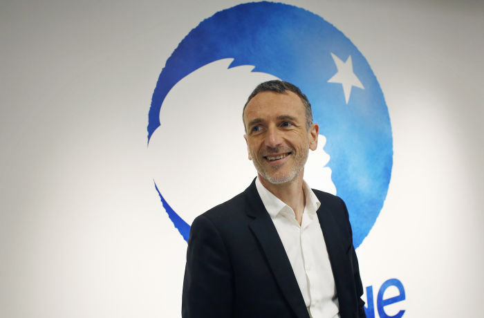Chief Executive of Danone company Emmanuel Faber poses for photographers prior to the company's 2017 annual results presentation in Paris, Friday, Feb. 16, 2018. Danone, the world's largest yoghurt maker, reported overall 2017 earnings that slightly beat expectations. (AP Photo/Thibault Camus)