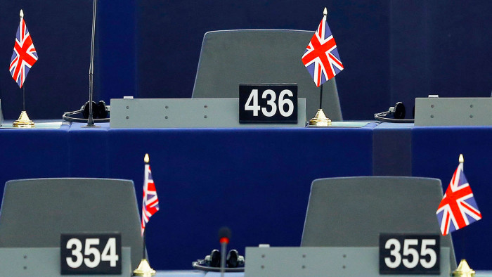 British Union Jack flags are seen on the desks of members of the European parliament ahead of a debate on the upcoming summit and EU referendum in the UK, in Strasbourg, France, February 3, 2016. REUTERS/Vincent Kessler