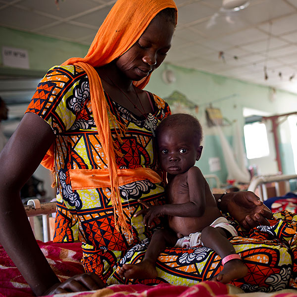 Nelkam Dadimra, 15, with her 10-month old daughter at a therapeutic feeding centre in N’Djamena