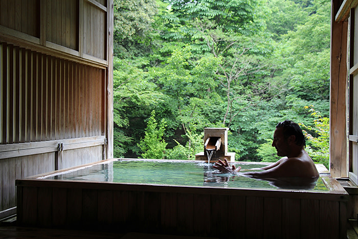 Guide Sakis Mits in the 'onsen' at Kayotei