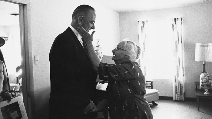 An elderly woman shows her gratitude to President Lyndon B. Johnson for his signing of the Medicare health care bill in April 1965. (Photo by Â© CORBIS/Corbis via Getty Images)