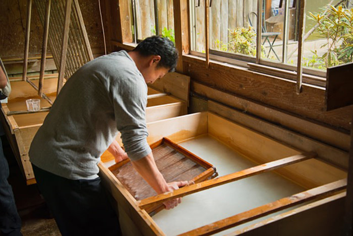Making paper using a bamboo screen