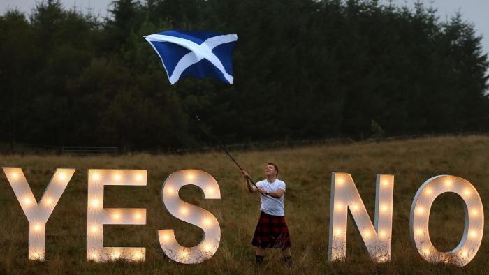 Previously unreleased photo dated 15/09/14 of businessman Jon Gamble from go2eventhire as he asks the question YES or NO with illuminated signs near Dunblane, Scotland, ahead of voting in the Scottish Referendum on September 18th. PRESS ASSOCIATION Photo. Issue date: Wednesday September 17, 2014. See PA story REFERENDUM Main. Photo credit should read: Andrew Milligan/PA Wire 