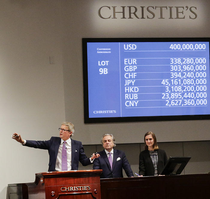 NEW YORK, NY - NOVEMBER 15: Auctioneer Jussi Pylkkanen (L) gestures as he sells the painting of the auction of Leonardo da Vinci's &quot;Salvator Mundi&quot; during the Post-War and Contemporary Art evening sale at Christie's on November 15, 2017 in New York City. The rediscovered masterpiece by the Renaissance master sells for an historic $450,312,500, obliterating the prevous world record for the most expensive work of art at auction. (Photo by Eduardo Munoz Alvarez/Getty Images)