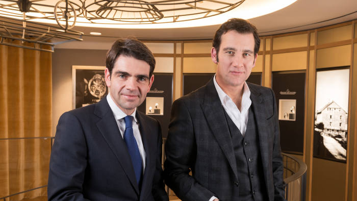 Jerome Lambert (left), Jaeger Lecoultre CEO, and Clive Owen pose during 'Jaeger Lecoultre Support UNESCO and Oceans World Heritage Conservation' Cocktail event at Jaeger-Lecoultre Place Vendome Boutique on February 7, 2013 in Paris, France