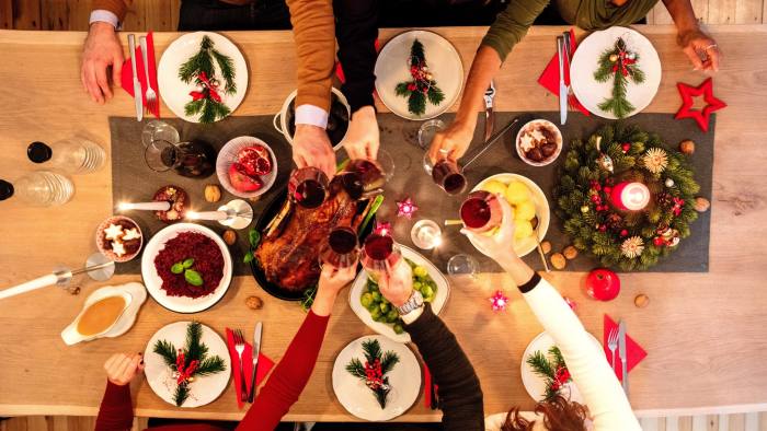 Overhead view of friends at table during christmas dinner