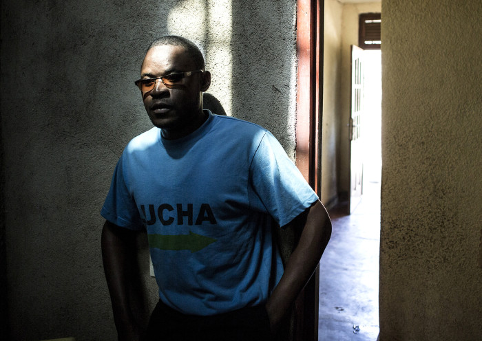 Clovis Mutsuva(25), a member of the Congolese activist group &quot;Lutte pour le Changement&quot; (LUCHA) poses for a portrait at his home on July 14, 2019 in Beni