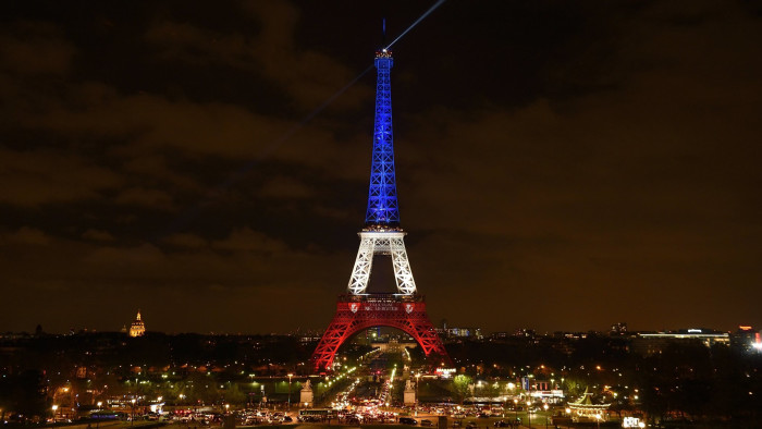 The Eiffel Tower illuminated with the colours of the French national flag