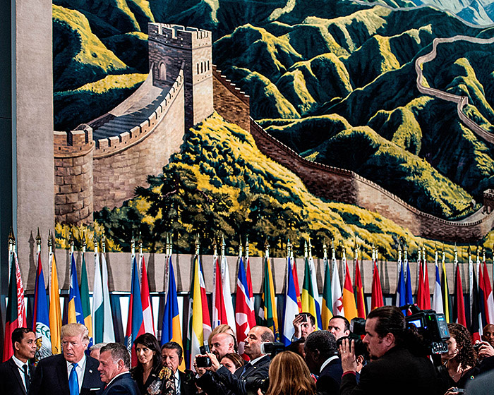 US President Donald Trump (L bottom) and Jordan's King Abdullah II stand below a tapestry with the Great Wall of China before a luncheon at the United Nations headquarters during the 72nd session of the United Nations General Assembly September 19, 2017 in New York City. / AFP PHOTO / Brendan Smialowski (Photo credit should read BRENDAN SMIALOWSKI/AFP/Getty Images)