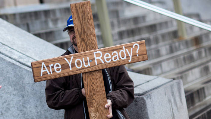A Christian demonstrates in Washington against a rally opposing religion in government, 2012 