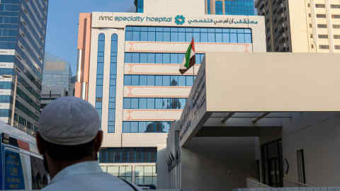 A logo sits on display outside the NMC Speciality Hospital, operated by NMC Health Plc, in Dubai, United Arab Emirates, on Sunday, March 1, 2020. Troubled NMC Health Plc, the largest private health-care provider in the United Arab Emirates, asked lenders for an informal standstill on its debt as Dubai weighs an injection of capital to safeguard the emirate’s reputation among global investors. Photographer: Christopher Pike/Bloomberg