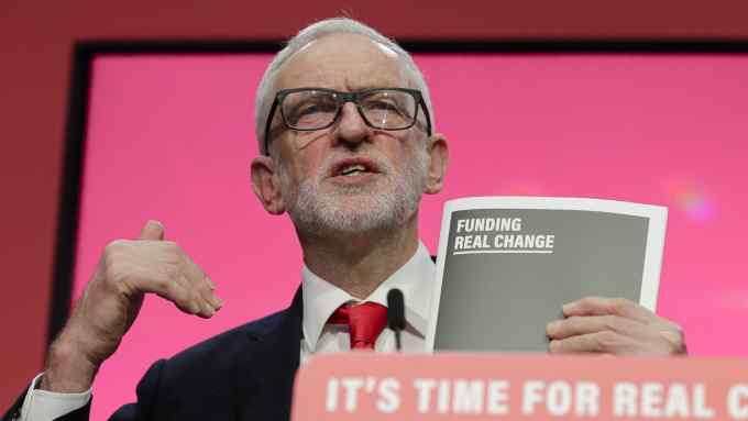 Jeremy Corbyn, Leader of Britain's opposition Labour Party, speaks on stage at the launch of Labour's General Election manifesto, at Birmingham City University, England, Thursday, Nov. 21, 2019. Britain goes to the polls on Dec. 12. (AP Photo/Kirsty Wigglesworth)