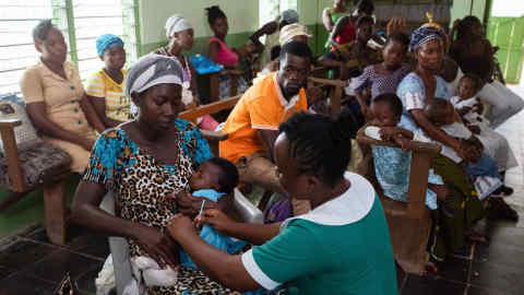 “Mother and child at a rural childhood vaccination clinic in the Central Region of Ghana”. WHO/Francis Kokoroko 2019