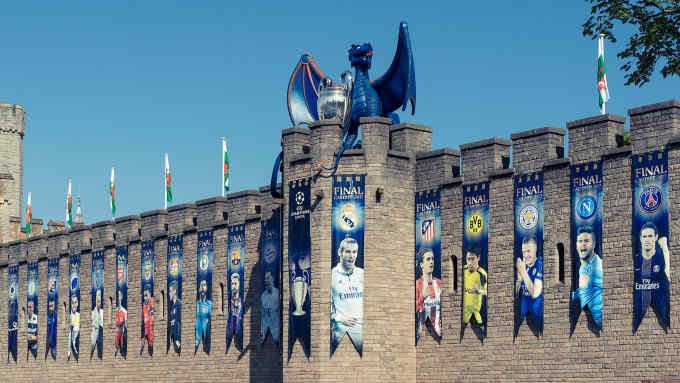 Flag day: Cardiff castle festooned with banners to celebrate the city hosting the Champions League final