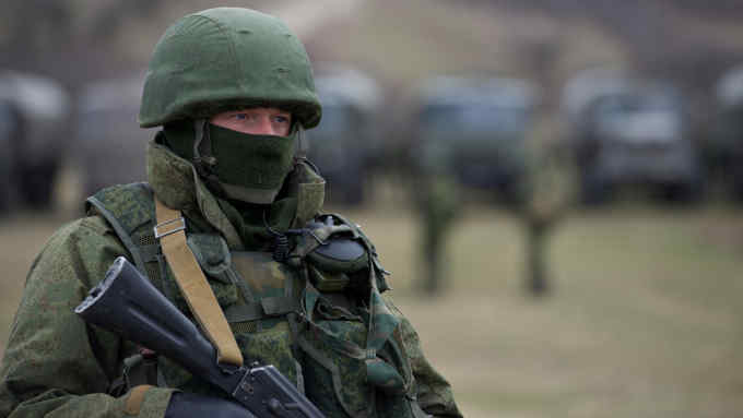 E981GK Armed Russian troops outside the Perevalne military base near Simferopol Crimea