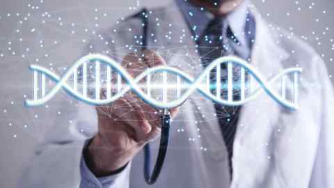 Doctor with spiral DNA molecules. Structure of the genetic code. Medicine concept. Genome, professional. CREDIT - Andranik Hakobyan | Dreamstime.com