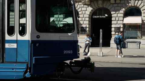 A tram passes by the front of the Credit Suisse Group AG headquarters in Zurich, Switzerland, on Sunday, Sept 29, 2019. Credit Suisse is seeking to draw a line under one of the worst scandals in its recent history after the bank hired a private detective agency to shadow former executive Iqbal Khan because of fears he’d poach employees after moving to UBS Group AG. Photographer: Stephen Kelly/Bloomberg
