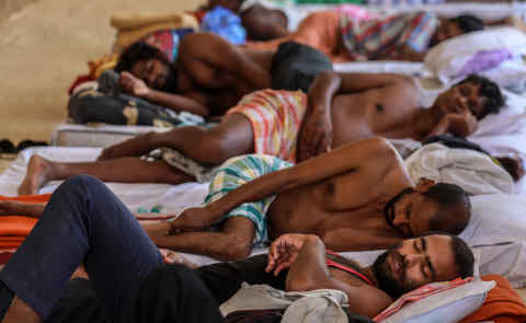 Mandatory Credit: Photo by DIVYAKANT SOLANKI/EPA-EFE/Shutterstock (10616609f) Indian people rest in a government shelter for migrant workers and homeless people, amid lockdown in Mumbai, India, 17 April 2020. India's Prime Minister Narendra Modi on 14 April announced that the country's initial 21-day lockdown will be extended until 03 May 2020, in an attempt to curb the spread of of the SARS-CoV-2 coronavirus which causes the COVID-19 disease. India lockdown extended until 03 May in wake of a coronavirus alert, Mumbai - 17 Apr 2020