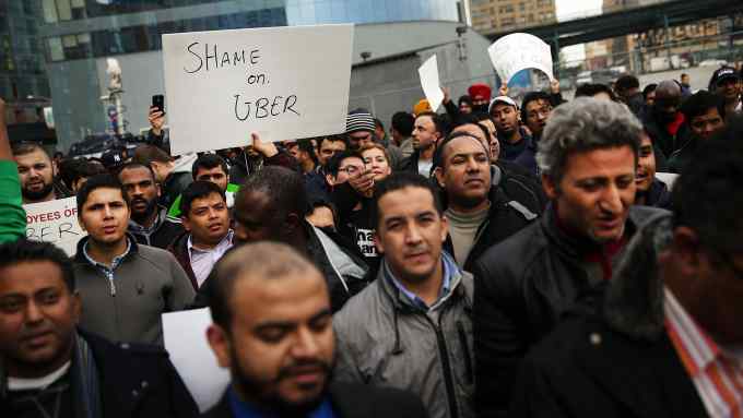 NEW YORK, NY - FEBRUARY 01: Uber drivers protest the company's recent fare cuts and go on strike in front of the car service's New York offices on February 1, 2016 in New York City. The drivers say Uber continues to cut into their earnings without cutting into its own take from each ride. In claiming fare reduction would mean more work for drivers, the San Francisco based company cut its prices by 15 percent last week. (Photo by Spencer Platt/Getty Images)