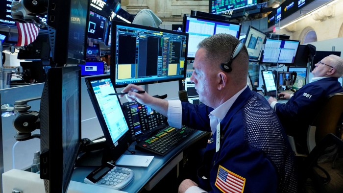 Traders looking at screens at the New York Stock Exchange 