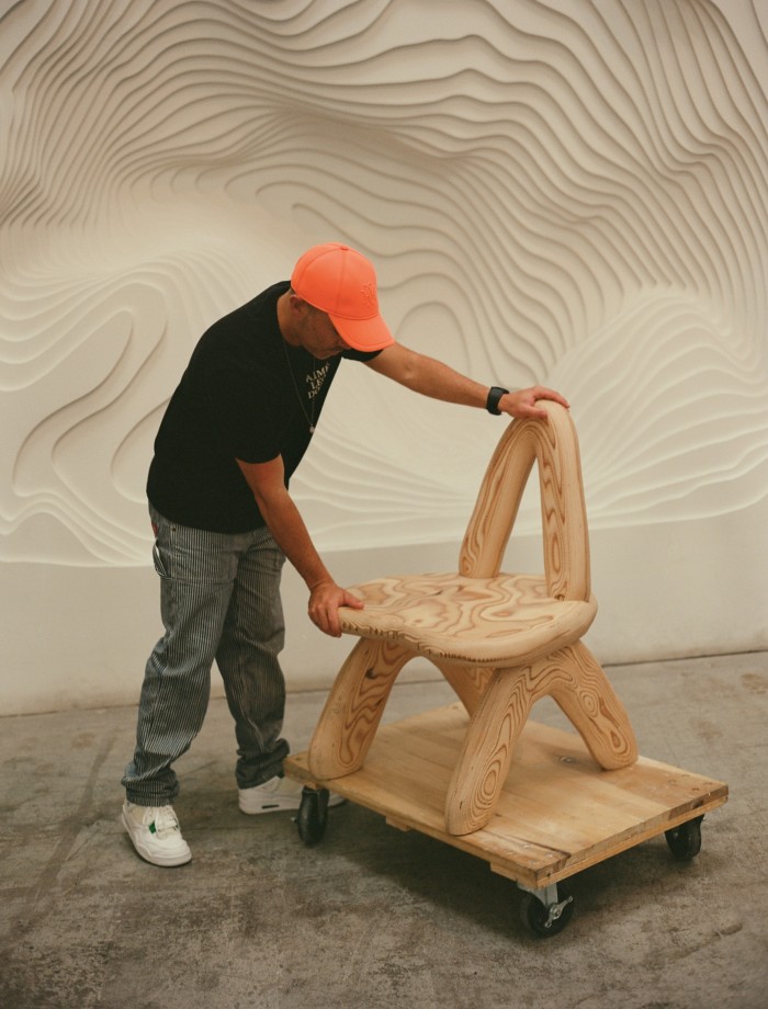 Arsham with the Dino Dining Chair prototype