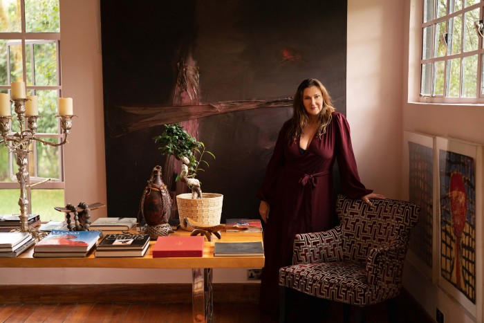 Anna Trzebinski in the drawing room of the studio annex at Eden; behind her is a work by her late husband Tonio Trzebinski