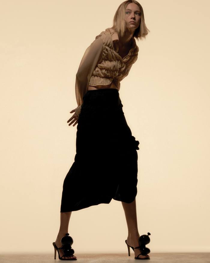 Khaite wool-mix top, £830, and washed cupro skirt, £800. Loewe leather Balloon sandals, £895
