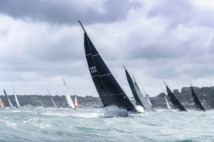 Tom Kneen’s British yacht Sunrise starting out from Cowes in difficult conditions in the 2021 Fastnet – they went on to win