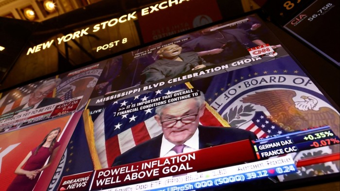 Federal Reserve chair Jay Powell appears on a screen on the trading floor of the New York Stock Exchange 