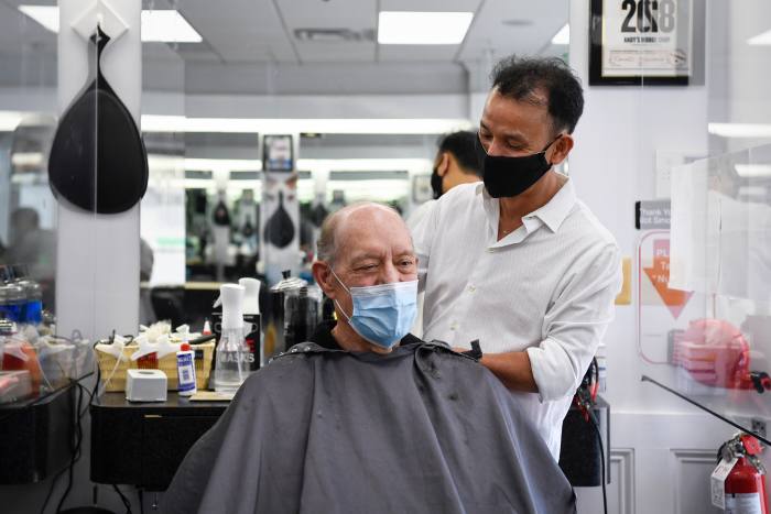 UNITED STATES - SEPTEMBER 3: Owner Andy Ton, right, gives James Henry a haircut at Andys Barber Shop on Thursday, Sept. 3, 2020. (Photo by Caroline Brehman/CQ-Roll Call, Inc via Getty Images)