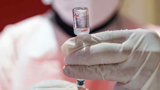 A healthcare worker prepares a dose of the Sinovac Biotech Ltd. Covid-19 vaccine