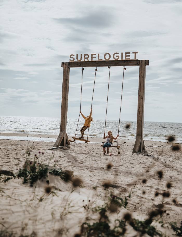 Swings on the beach at Surflogiet