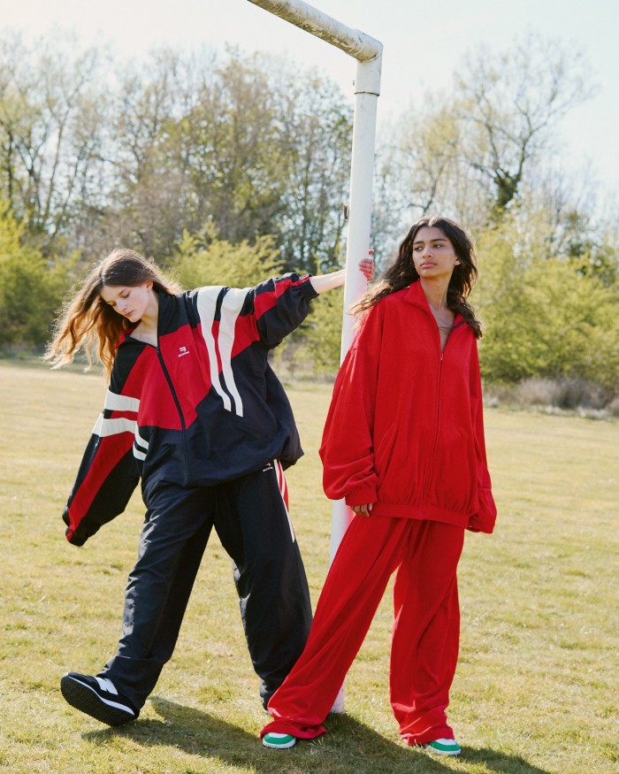 From left: Primrose wears Balenciaga nylon jacket, £1,250, and trousers, £850. New Balance 237 trainers, £75. Scarlett wears Balenciaga velvet jacket, £1,190, and trousers, £725. Nike vintage shoes, Scarlett’s own