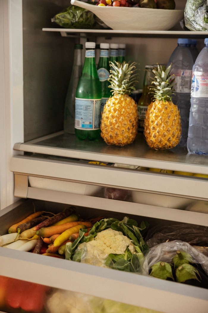 Staples in his fridge include pineapples for fresh juice