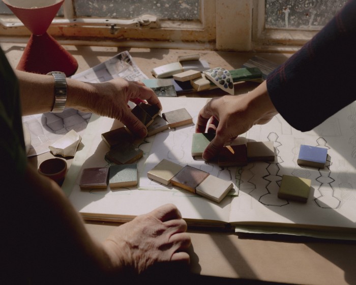 Tassie and Morgan-Cox working with glaze test tiles