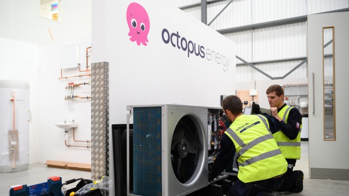 engineers install a Daikin 9kw heat pump at the Octopus Energy training facility