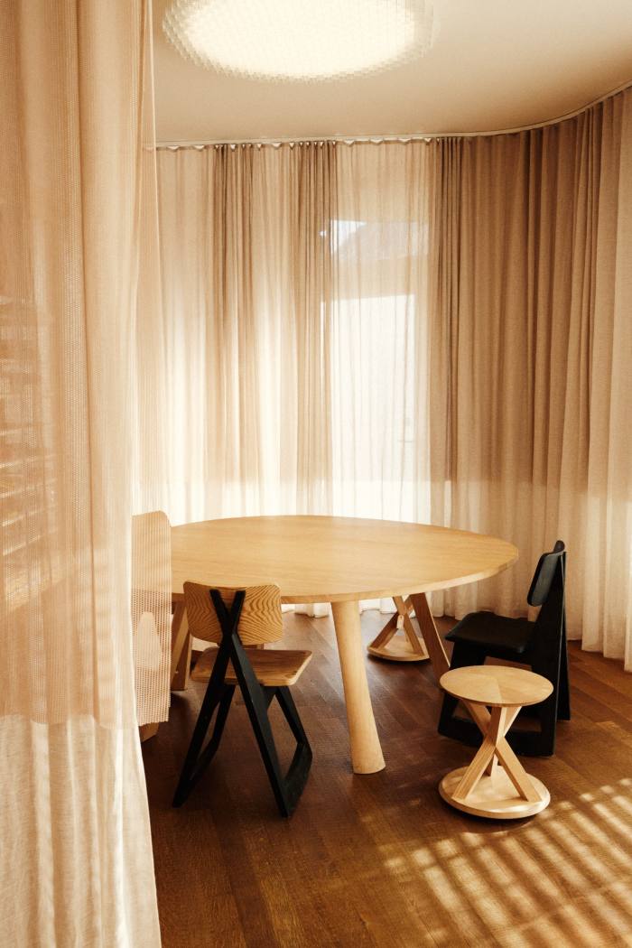 A meeting room featuring the H&deM Tenerife Table and in-house-produced furniture prototypes