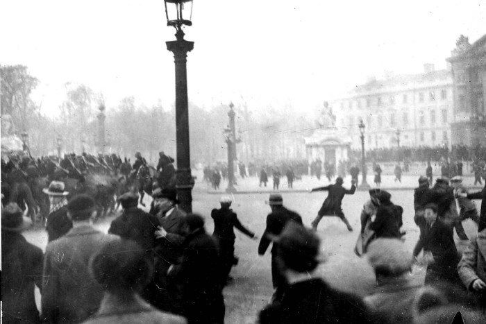 Rioters throw projectiles at police during the 1934 riots