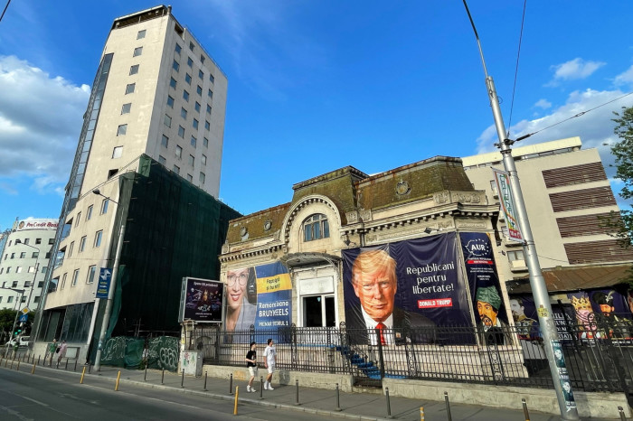 An AUR campaign centre in Bucharest draped in a banner depicting Donald Trump, with the caption: ‘Republicans for freedom’