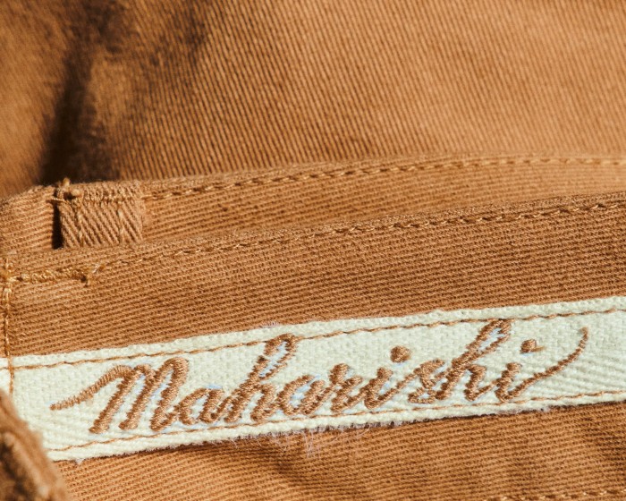 His Maharishi trousers