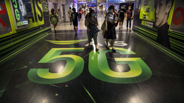 5G advertising on the floor and walls of a metro station in Bangkok