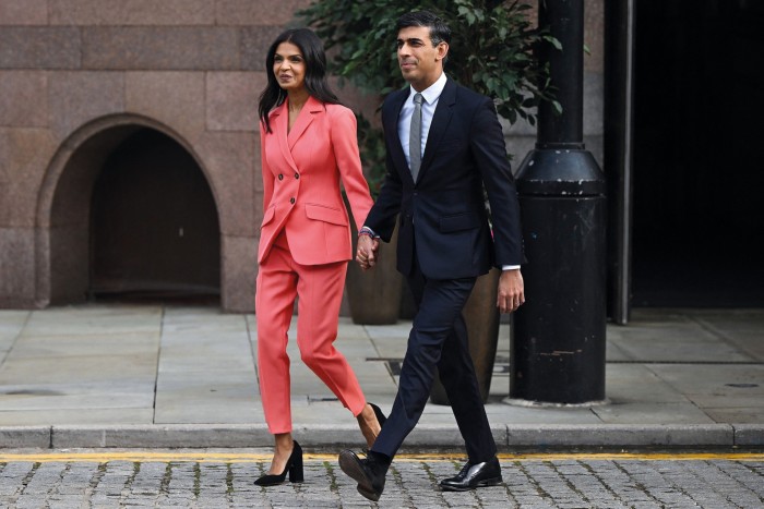 Britain’s Prime Minister Rishi Sunak and his wife Akshata Murty walking hand in hand